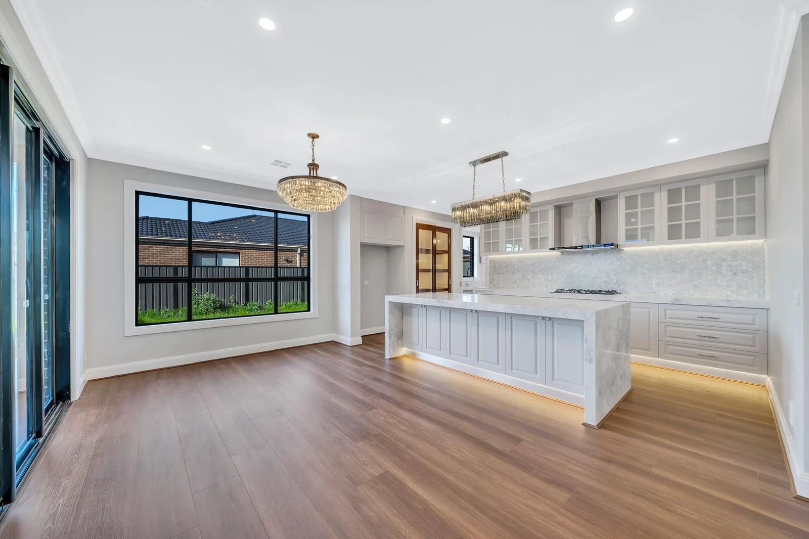 Open plan living and kitchen with timber floors