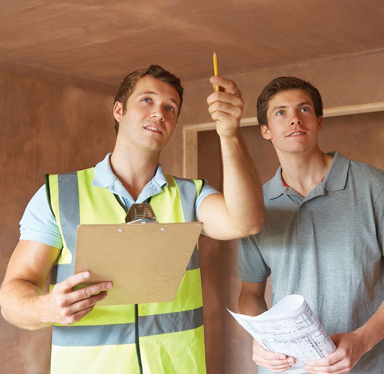 a professional inspector guiding another person with a report in his hand